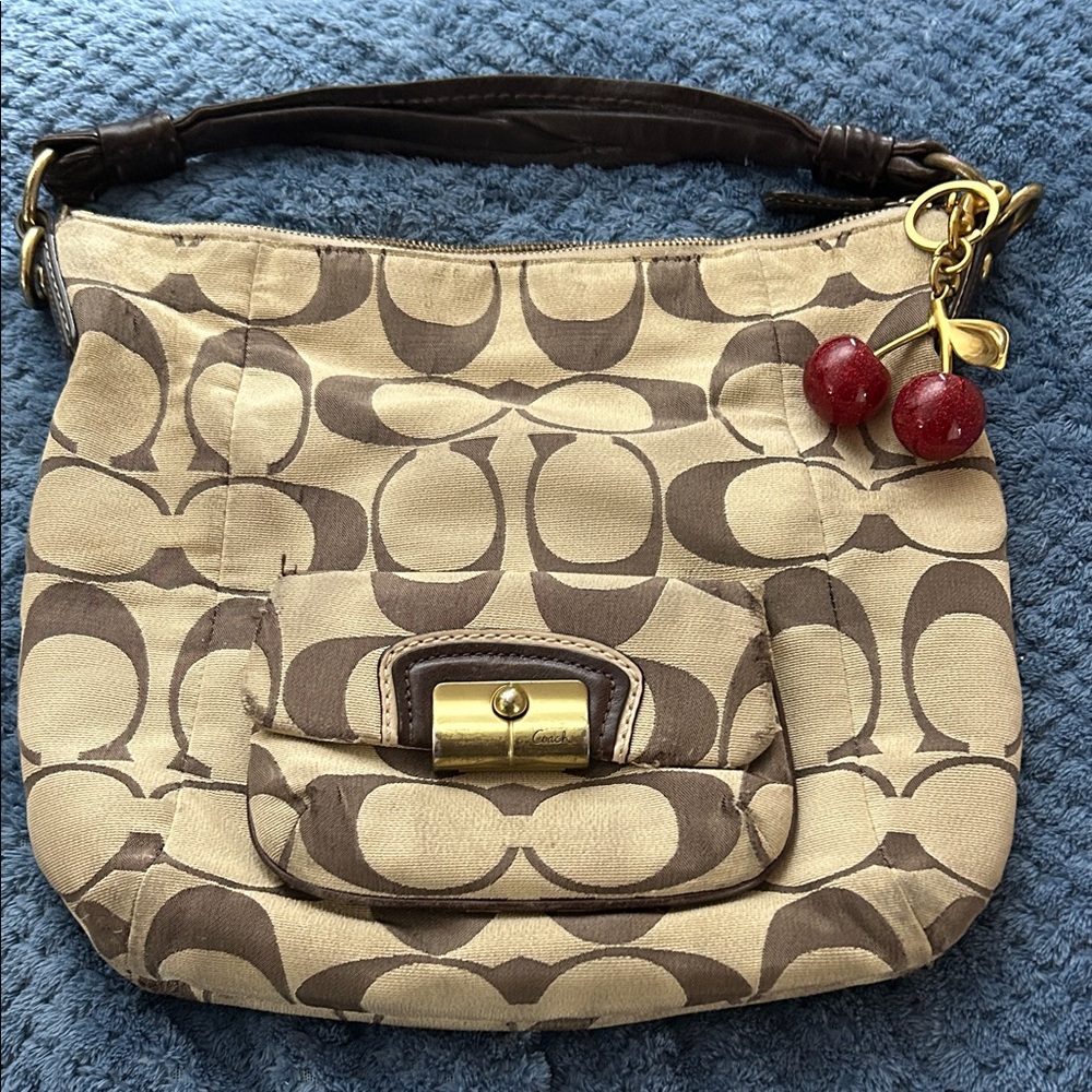 Coach Beige and Brown Signature Canvas Shoulder Bag with Red Cherry Charm